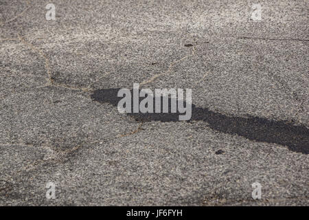 Asphalt background texture with some fine grain . Stock Photo