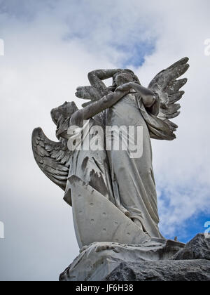 New Orleans, LA USA - Jun 2, 2017  -  Angels on Top of Tomb Stock Photo