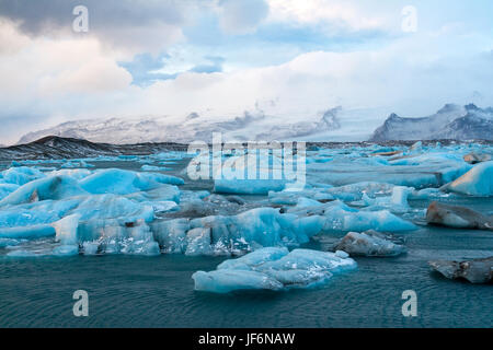 Icebergs drifting to sea in Jokulsarlon - Iceland Stock Photo