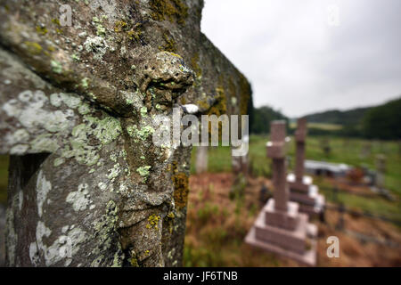 Carved figure of Jesus on a gravestone Stock Photo