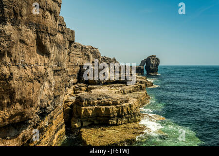 Seascape depicting the Pulpit Rock from the Quarries pathway, with clear blue skies and calm seas on a beautiful summers day. Stock Photo