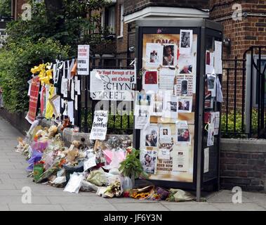 Grenfell Tower burnt out shell and tributes to the dead Stock Photo