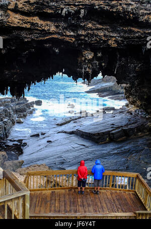 Tourists visit the cave of Admirals Arch on Kangaroo Island, South Australia. The island lies in the state of South Australia 112 km (70 mi) southwest Stock Photo