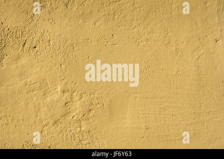 Ocher house plastered wall Stock Photo