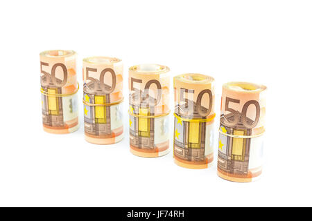 Rolls of euro notes in row on white Stock Photo