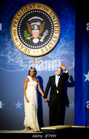 President Barack Obama and first lady Michelle Obama wave to audience after dancing at the Commander-in-Chief's Ball at the National Building Museum in Washington, D.C., Jan. 20, 2009. The ball honored America's service members, families of the fallen, and wounded warriors. DoD photo by Mass Communication Specialist 1st Class Chad J. McNeeley Stock Photo