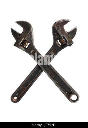 Two old rusty spanners crossing on white background Stock Photo