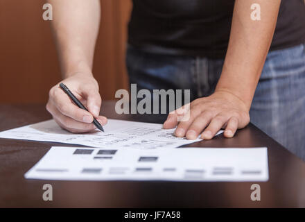 The designer in working process, at a table does sketches by a pencil Stock Photo