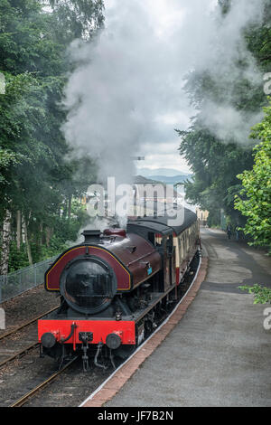 Steam locomotive leaving Lakeside Railway Station Lake District Stock Photo