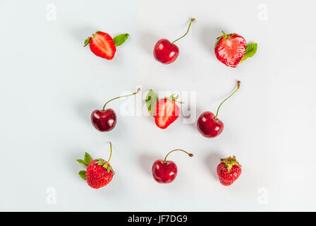 Fresh raw organic seasonal fruits and berries. The seamless pattern, cherries, mint, strawberry on a white background. Top view copy space Stock Photo