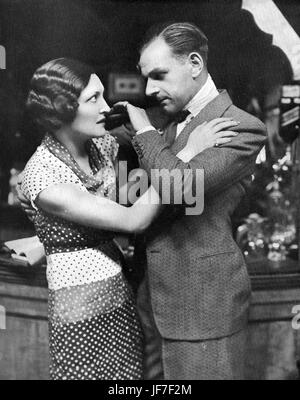 'The Old Man' by Edgar Wallace.  Caption reads:  'Keller: 'If you open your mouth, I'll throttle you.'1931 London production  with Frances Doble (1902-1969) and Jack Melford (1899-1972). ( Wyndham's Theatre 15 May, 1931.) Stock Photo