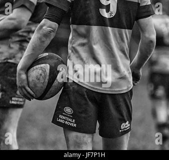 Rugby player holding a ball Stock Photo