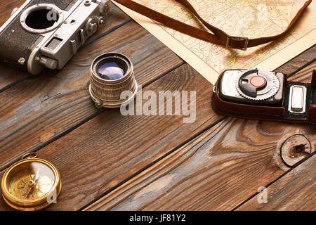 Vintage camera and lens on antique XIX century map Stock Photo