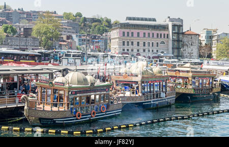 Istanbul, Turkey - April 25, 2017: Traditional fast food bobbing boats serving fish sandwiches at Eminonu Stock Photo
