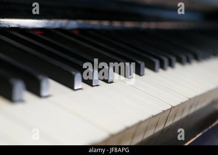 Ancient piano detail. Warm toned image, selective focus Stock Photo