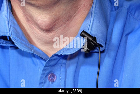 Clip the microphone on the shirt Stock Photo