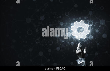 Close of human hand touching with finger setting glowing icon Stock Photo