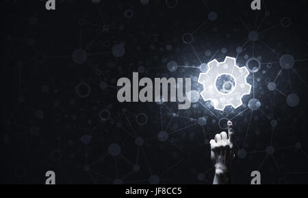 Close of human hand touching with finger setting glowing icon Stock Photo