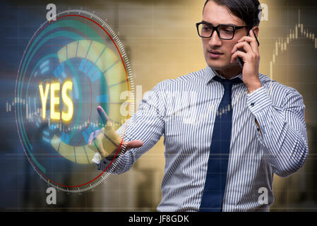 Businessman pressing virtual button YES Stock Photo