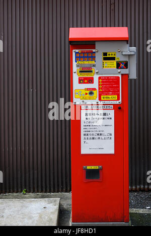 Red, Japanese parking ticket machine. Pay and display Stock Photo