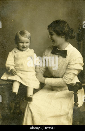 Victorian portraiture, family portrait, woman wearing a dress with leg ...