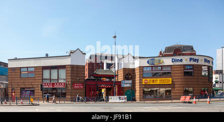 Exterior of the Day In Oriental Supermarket and the Sum Ye Chinese Restaurant and fast food takeaway in The Arcadian, Chinatown, in central Birmingham Stock Photo