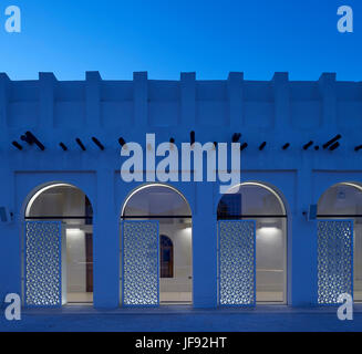 Detail of inner courtyard window at dusk. Bin Jelmood House, Doha, Qatar. Architect: John Macaslan and Partners, 2017. Stock Photo