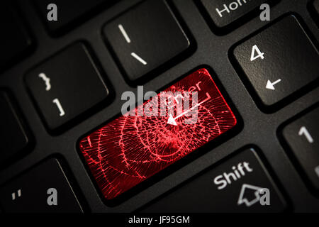 Message on broken red enter key of keyboard. Computer virus attack. Copy space Stock Photo