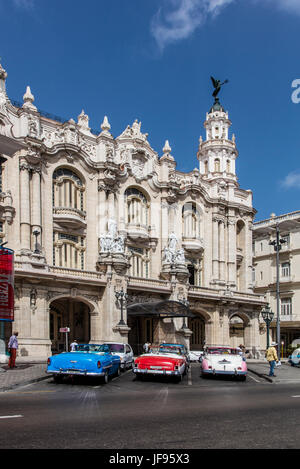 AMERICAN CARS are used as taxis in front of of the GRAND TEATRO DE HABANA - HAVANA, CUBA Stock Photo