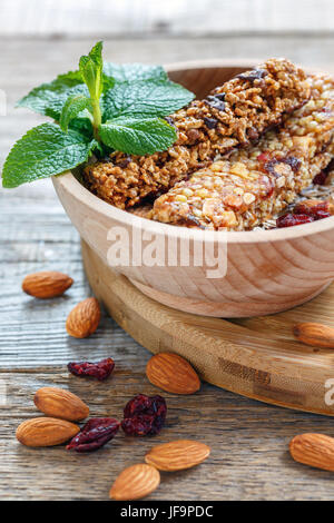 Bars of cereals, nuts, dried fruits and honey. Stock Photo