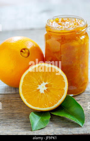 Oranges and jar of jam. Stock Photo