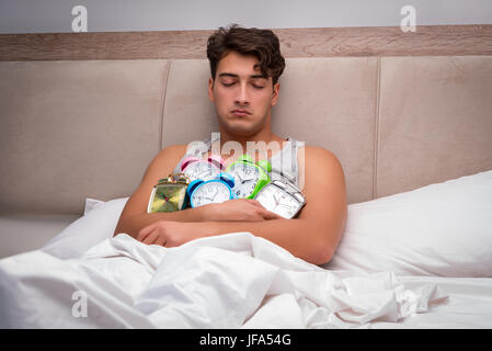 Man having trouble waking up in the morning Stock Photo