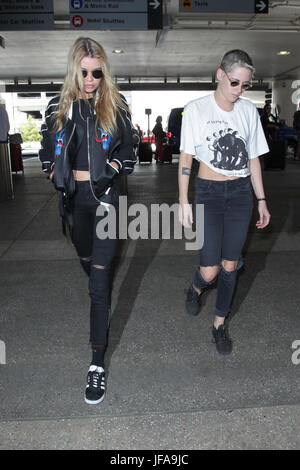 Los Angeles, Ca, USA. 29th June, 2017. Stella Maxwell and Kristen Stewart seen at LAX in Los Angeles, California on June 29, 2017. Credit: John Misa/Media Punch/Alamy Live News Stock Photo