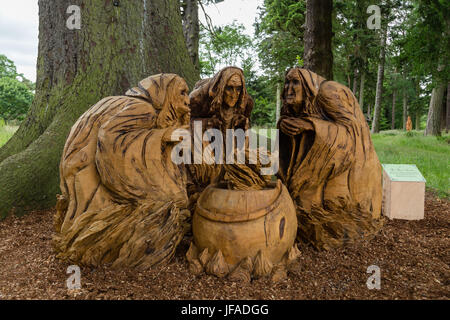 Glamis, UK. 30th June 2017. Glamis Castle launches Macbeth trail. Wooden sculpture of The Three Witches from Act 1 Scene 1 of Macbeth made by Neith Art & Sculpture. Anne Johnston/Alamy Live News Stock Photo