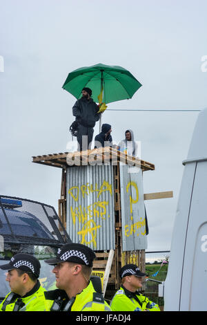 Blackpool, UK. 30th June, 2017. Cuadrilla's shale gas fracking site at Little Plumpton, Blackpool was targeted by anti-fracking protesters who built two towers, made from wooden palettes, overnight along with four protesters who locked themselves together in front of the site entrance using steel tubes. Around 100 anti-fracking protesters were in attendance along Preston New Road in the vicinity of the site. Credit: Dave Ellison/Alamy Live News Stock Photo