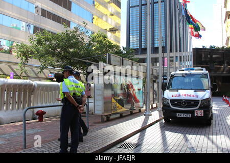 Police presence upon Hong Kong's Harbour Road- this is to guard President Xi Jinping who is diagonally opposite this spot, banqueting, 1st day of trip Stock Photo