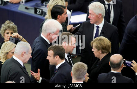 Strasbourg, France. 1st July, 2017. German Chancellor Angela Merkel (2nd r, CDU), French President Emmanuel Macron (front c), Israeli Prime Minister Benjamin Netanjahu (front r), Russian Prime Minister dmitry Medvedev and former US-President Bill Clinton (back r) participate in the European obsequies for late former chancellor Helmut Kohl at the European Parliament in Strasbourg, France, 1 July 2017. Kohl died on 16 June 2017 in the age of 87. The chancellor of the German unity held office for 16 years. Photo: Michael Kappeler/dpa/Alamy Live News Stock Photo