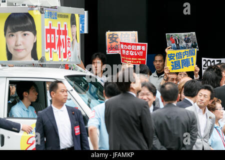 Tokyo, Japan. 1st July, 2017. Anti-Abe protesters appear during a campaign event of the Liberal Democratic Party of Japan for tomorrow's Tokyo Metropolitan Assembly election on July 1, 2017, Tokyo, Japan. A group of anti-Abe protesters appeared holding placards and chanting against the Prime Minister during the campaign event in support of LDP party candidate Aya Nakamura. Credit: Rodrigo Reyes Marin/AFLO/Alamy Live News Stock Photo