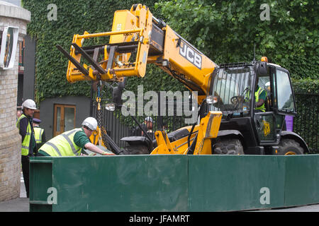 London, UK. 1st July, 2017. Workmen install metal barriers outside the gates of the All England Lawn tennis club following recent terror attacks on London with increased security measures to protect visitors as security is beefed up for the tournament Credit: amer ghazzal/Alamy Live News Stock Photo
