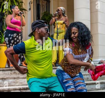 Dancers appreciate the sound of a  RUMBA GROUP playing Afro-Cuban music in VEDADO - HAVANA, CUBA Stock Photo