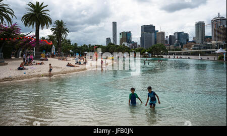Streets Beach lagoon in the South Bank Parklands with city skyline in background. Brisbane, Queensland, Australia Stock Photo