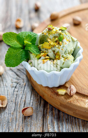 Homemade pistachio ice cream in a ceramic cup. Stock Photo