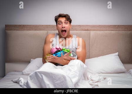 Man having trouble waking up in the morning Stock Photo