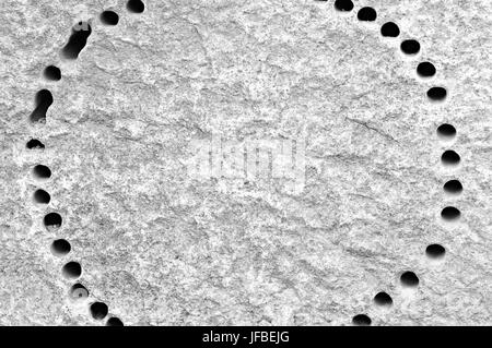 Round drilled in hard granite black-white Stock Photo