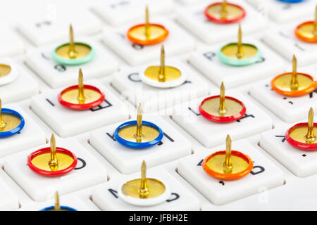 Pins on computer keyboard Stock Photo