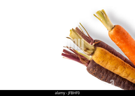 Baby Rainbow Carrots on White Background Stock Photo