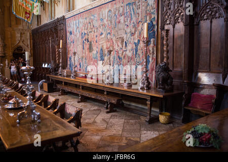 Tourists enter the dining room at Hearst Castle, which has extensive furniture, tables, tapestries, sculptures and artwork. Stock Photo