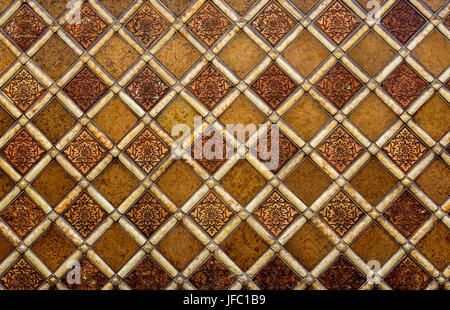 Diamond pattern wall tiles on an exterior of a building. Stock Photo