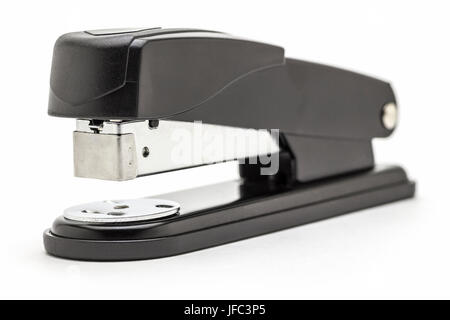 Stationery black office stapler close up on a white background. Stock Photo