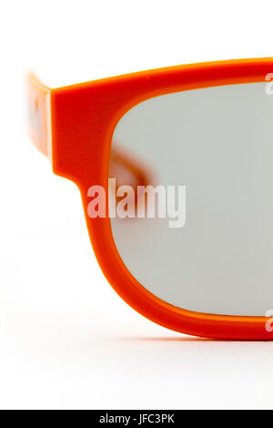 Part of the plastic pink glasses closeup on white background. Stock Photo